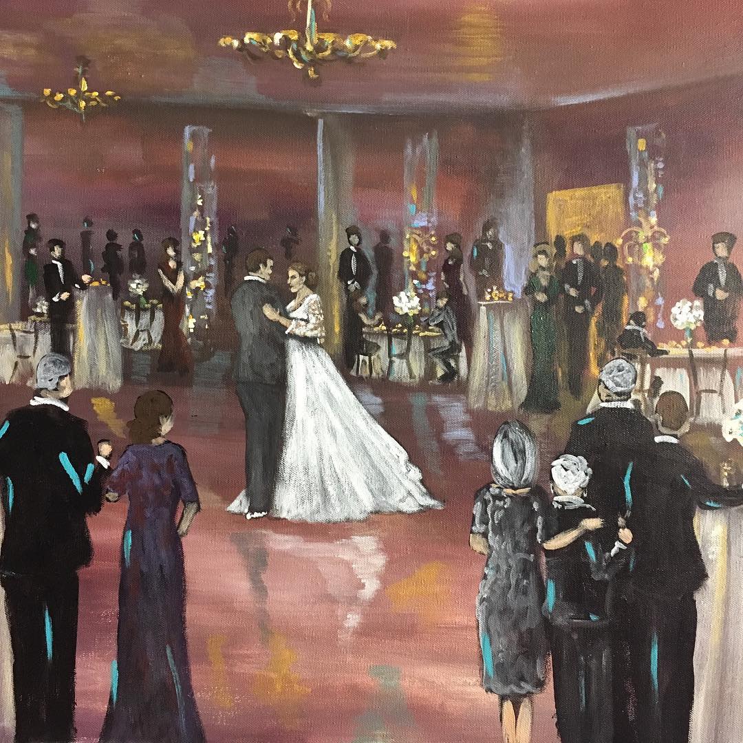 Live painting of a wedding first dance with family watching in the foreground