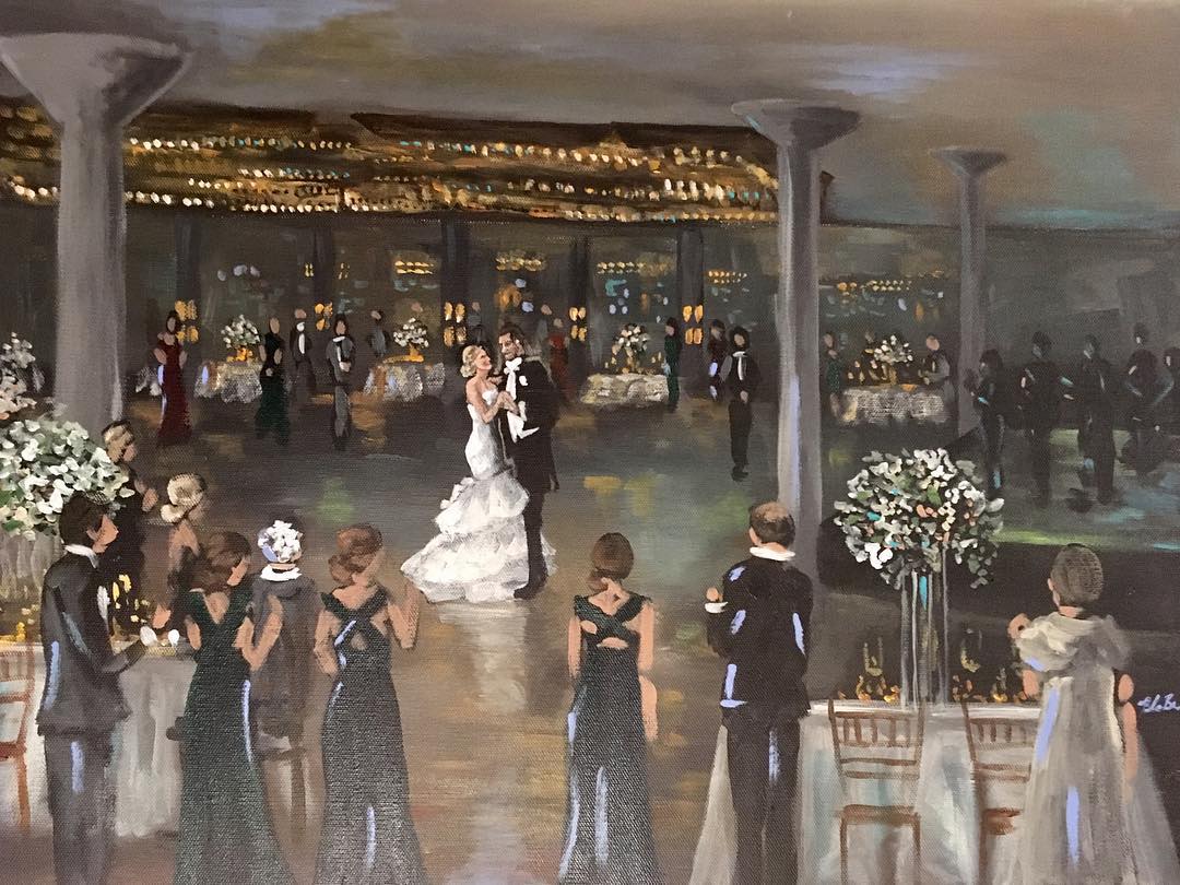 Blaire Brown live wedding painting of a first dance under glowing string lights and tall columns at The Astorian, bridesmaids looking on
